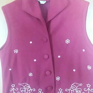 A maroon fleece vest. No size but guessing 1x